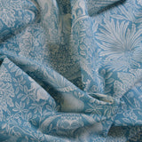 Blue fabric with white floral and leaf pattern