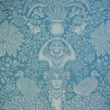 Decorative fabric with classical design elements on a blue background