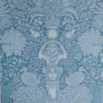 Decorative wallpaper with classical design elements on a blue background