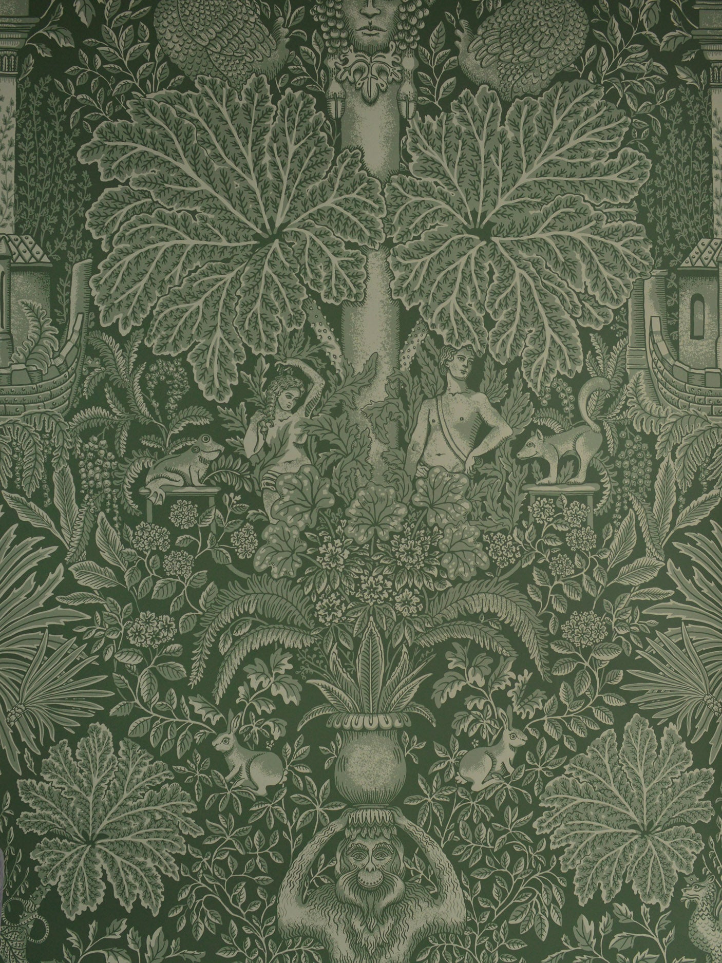 Decorative wallpaper with intricate green leaf and fantasy design on a dark background