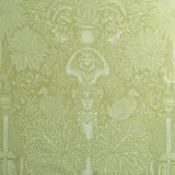 Decorative fabric with classical elements and foliage on a green background