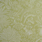 Green fabric with white floral and leaf pattern
