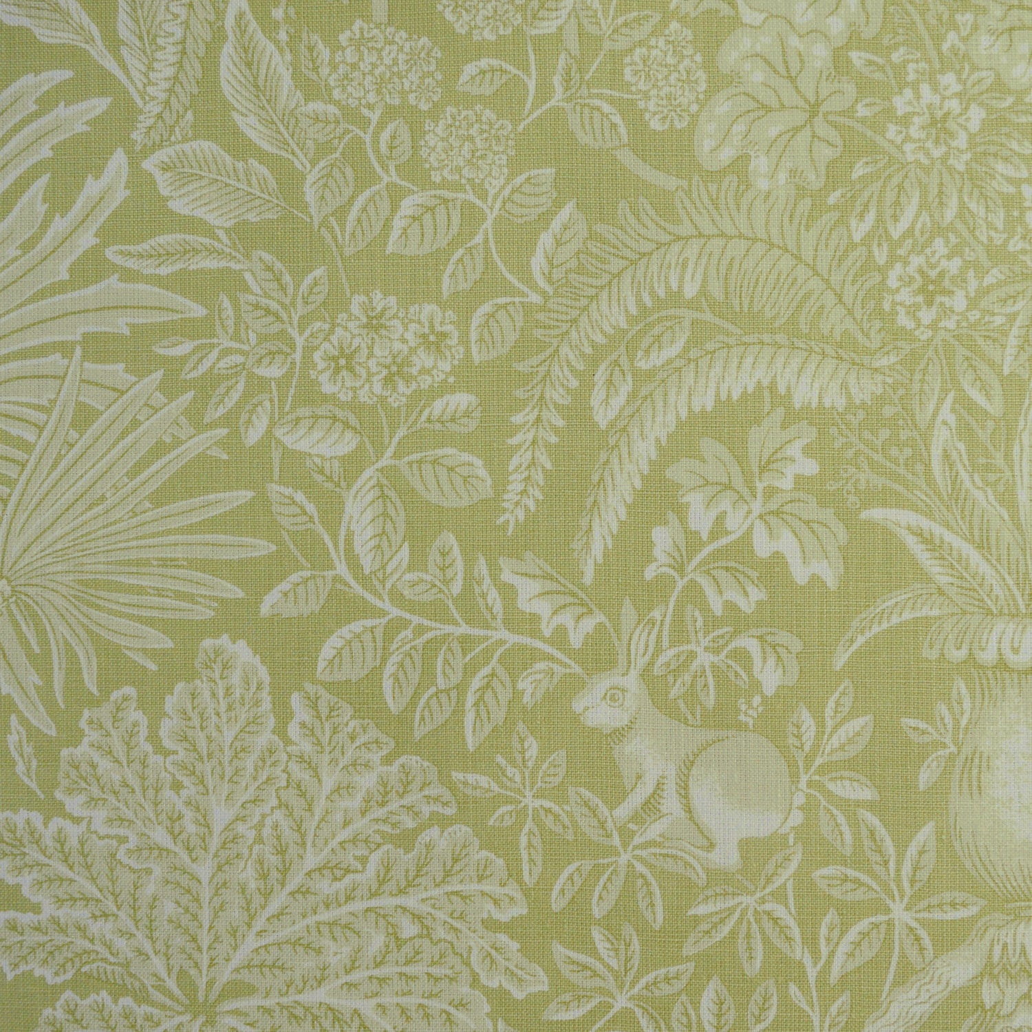 Green fabric with white floral and leaf pattern