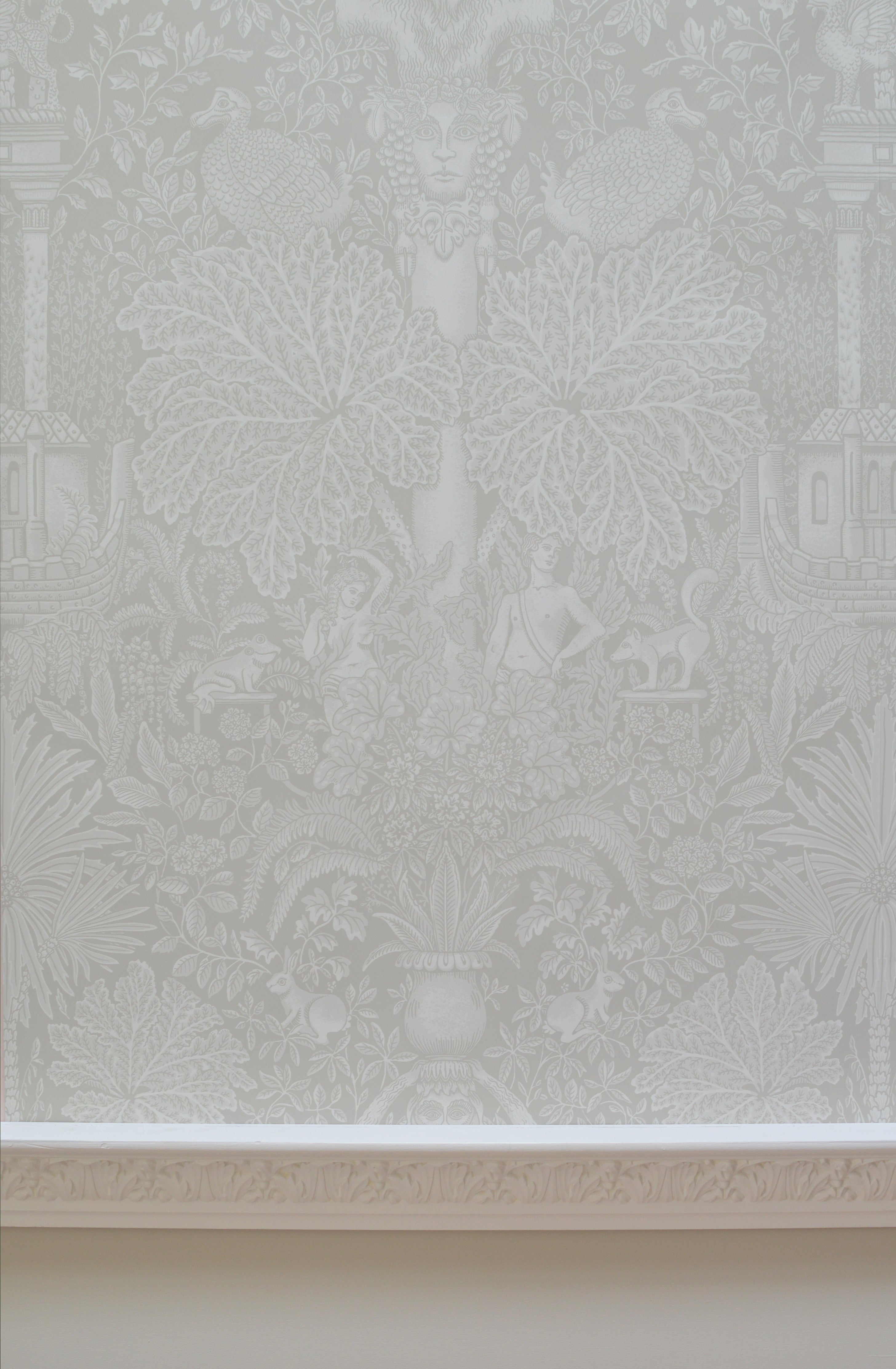 Wallpaper with a  classical illustrated pattern on a grey background