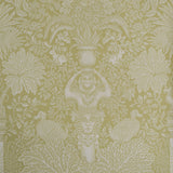 Decorative wallpaper with intricate patterns of leaves, flowers, and classical elements on a green background.