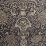 Decorative fabric pattern with classical figures, animals, and foliage on a dark background