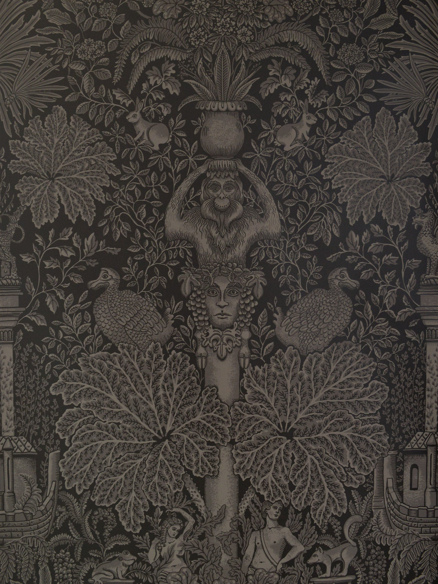 Decorative fabric pattern with intricate designs on a dark background