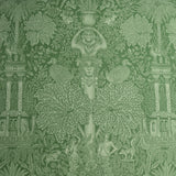 Decorative fabric pattern with classical elements and foliage on a green background