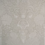 Decorative wallpaper with intricate floral and leaf patterns in a neutral color.