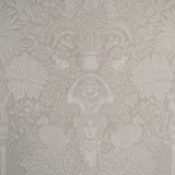 Decorative wallpaper with intricate floral and leaf patterns in a neutral color.
