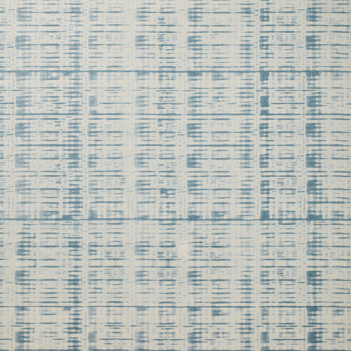 Detail of wallpaper in a textural stripe print in shades of blue on a cream field.