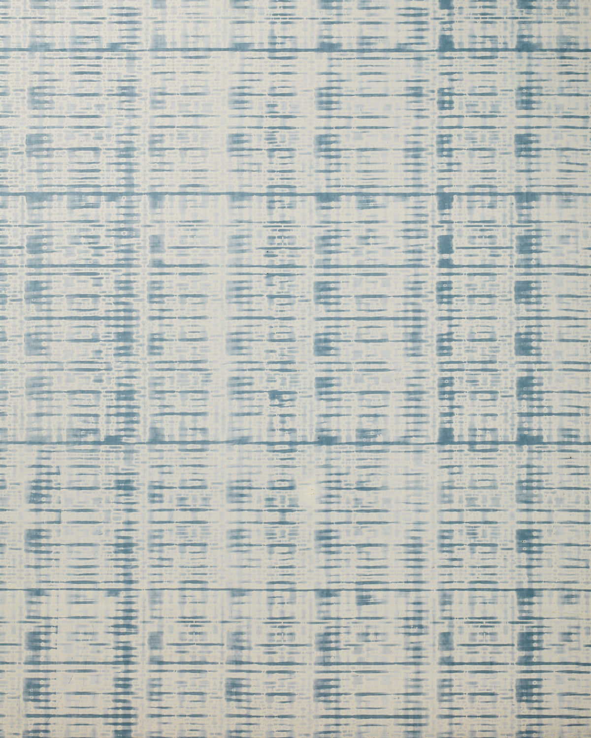 Detail of wallpaper in a textural stripe print in shades of blue on a cream field.