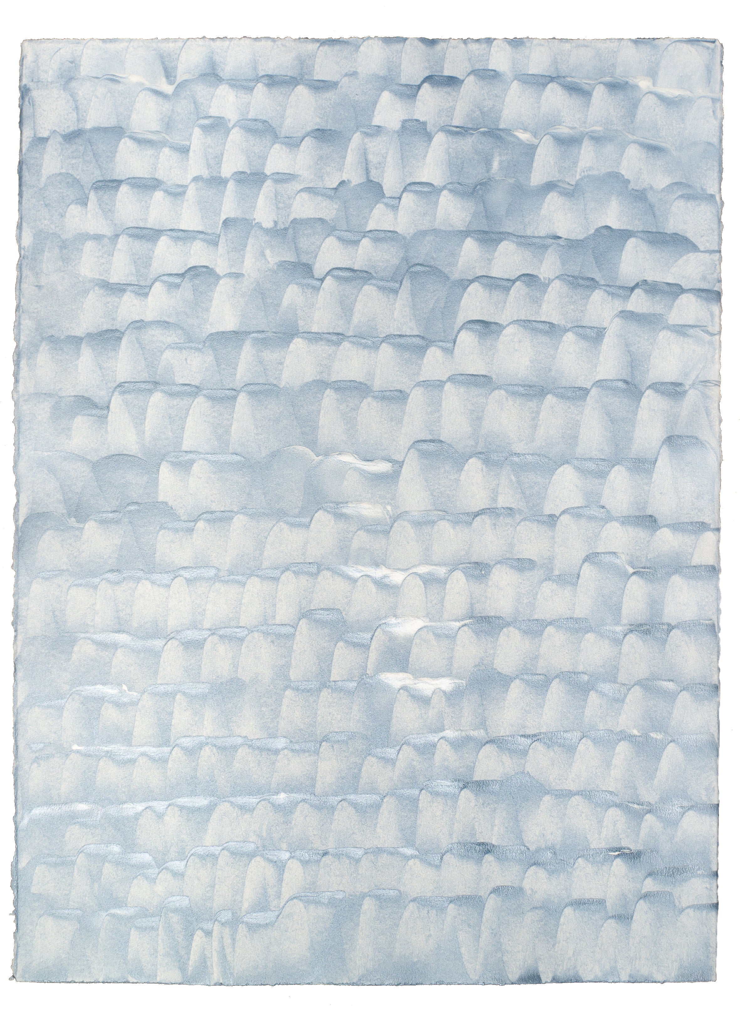 Sheet of hand-painted wallpaper with a repeating dappled texture in light blue.