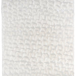 Sheet of hand-painted wallpaper with a repeating dappled texture in cream.