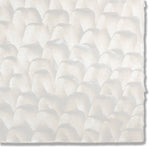 Detail of a hand-painted wallpaper swatch with a repeating dappled texture in cream.