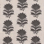 Detail of fabric in a repeating thistle print in gray on a cream field.