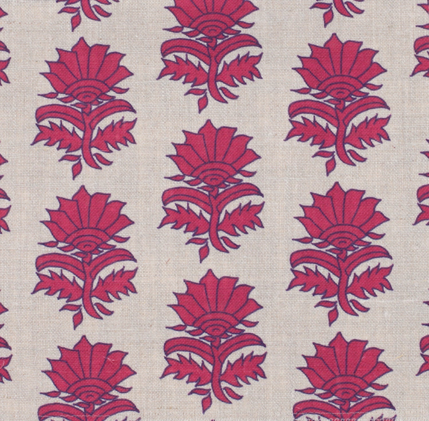 Detail of fabric in a repeating thistle print in pink and purple on a tan field.