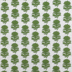 Detail of fabric in a repeating thistle print in green on a cream field.
