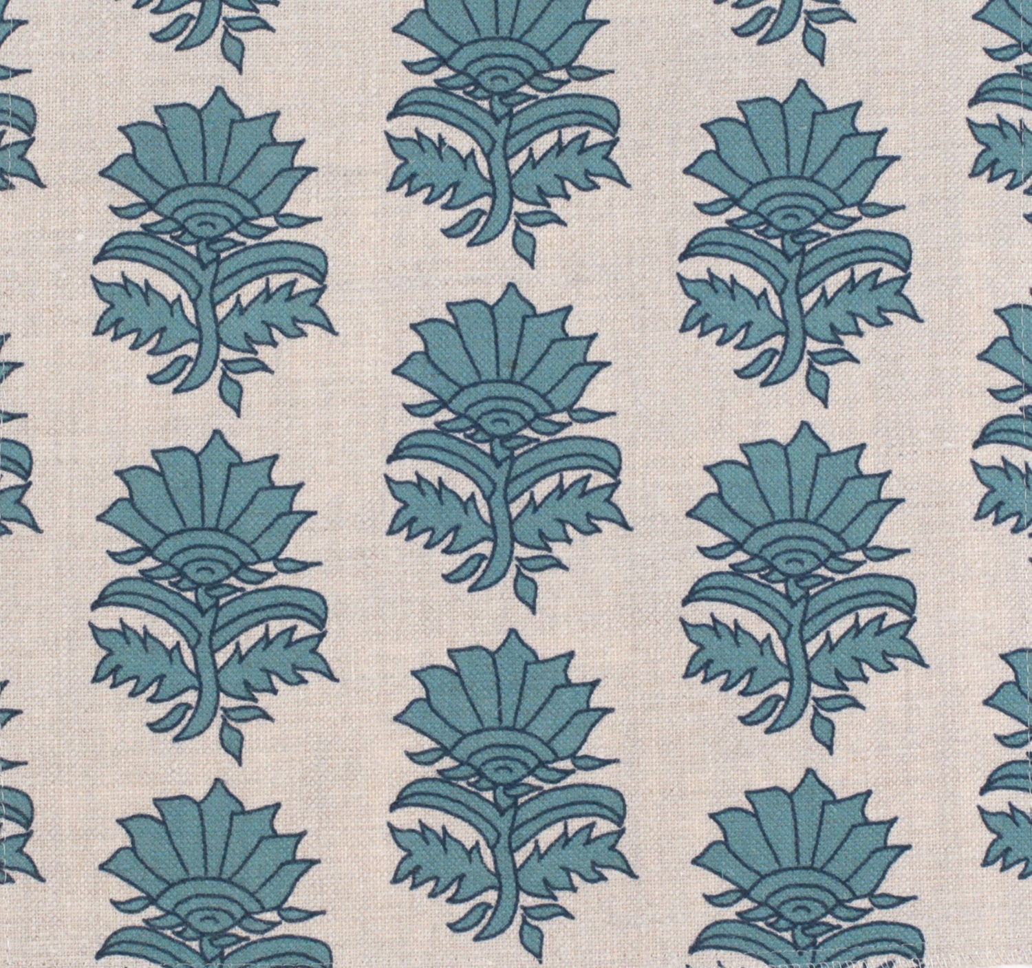 Detail of fabric in a repeating thistle print in navy and turquoise on a cream field.