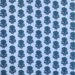 Detail of fabric in a repeating thistle print in navy and turquoise on a light blue field.