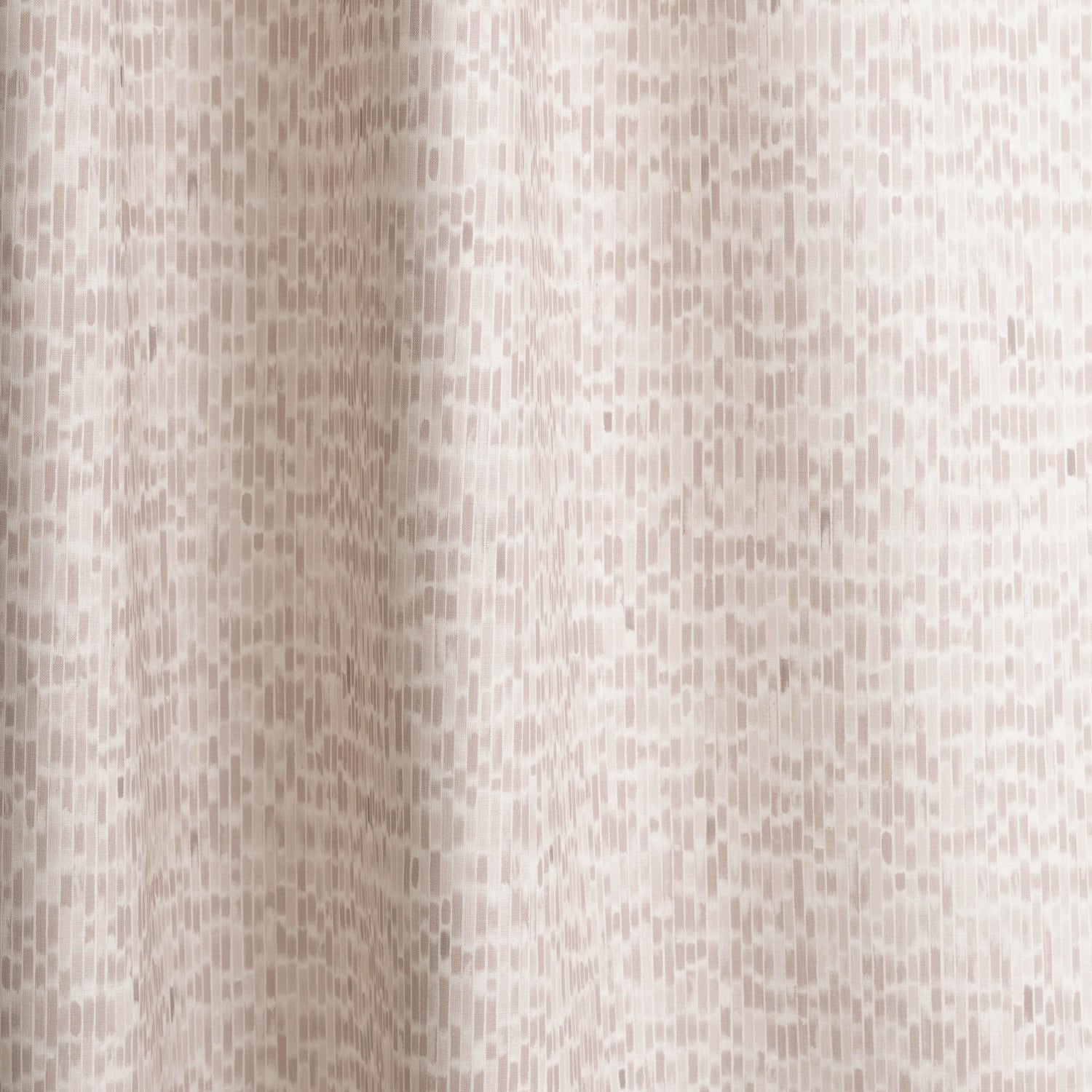 Gently draped fabric in a linear check pattern in shades of pastel mauve on a white field.