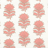 Detail of fabric in a repeating thistle print in pink and green on a white field.