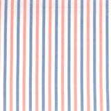 Detail of fabric in a small-scale stripe print in pink and blue on a white field.