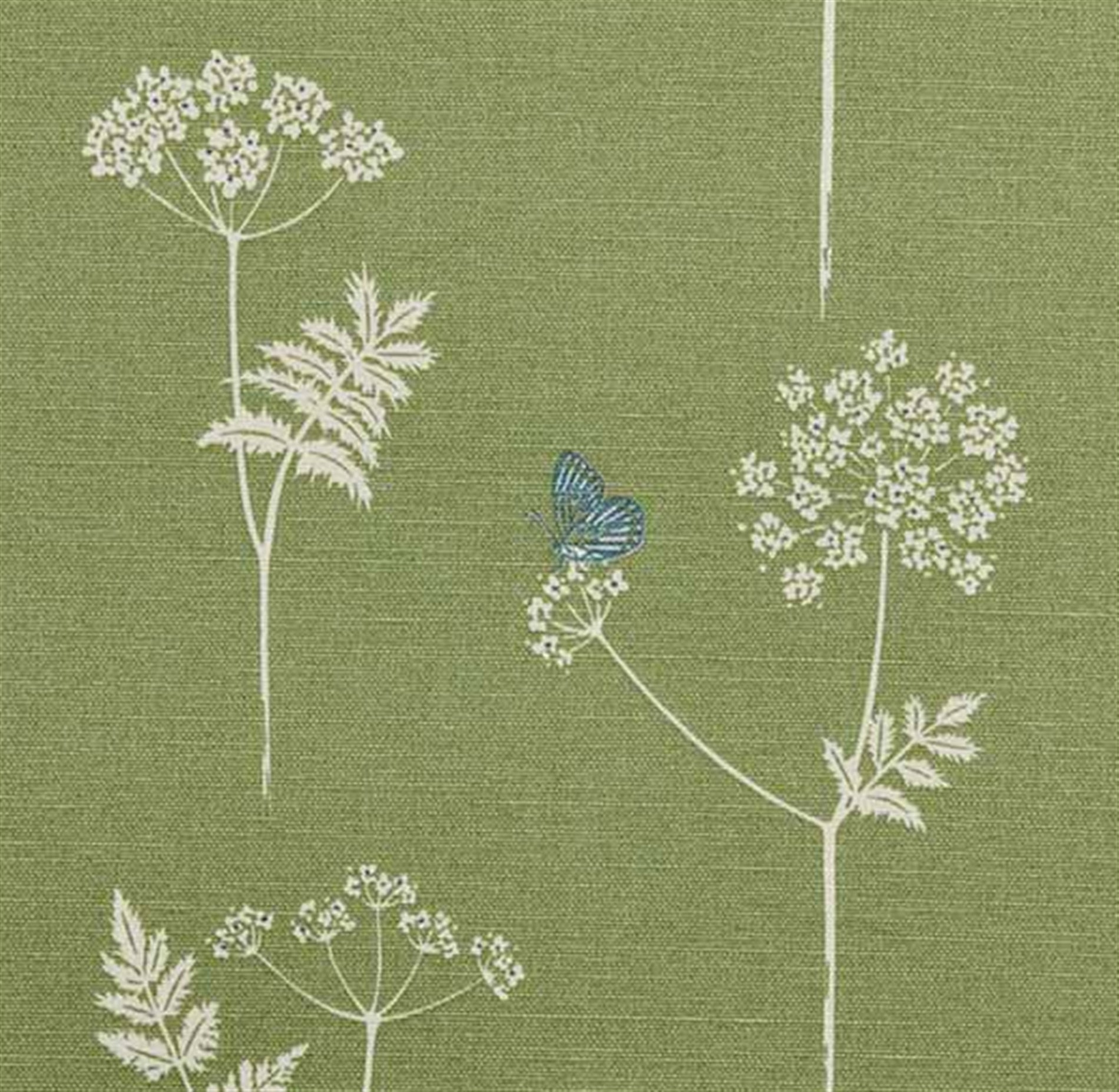 Detail of fabric in a playful flower and butterfly print in white and blue on a green field.