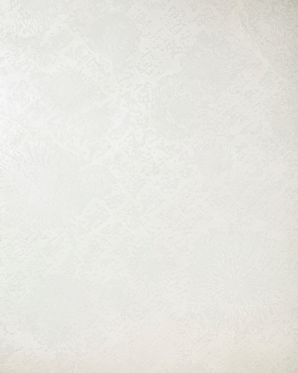 Detail of wallpaper in a textural botanical print in metallic cream on a cream field.