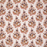 Patterned fabric with floral design in brown, pink and purple on a light background