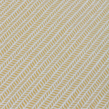 Detail of a wallpaper panel in a painterly herringbone print in yellow on a light blue field.