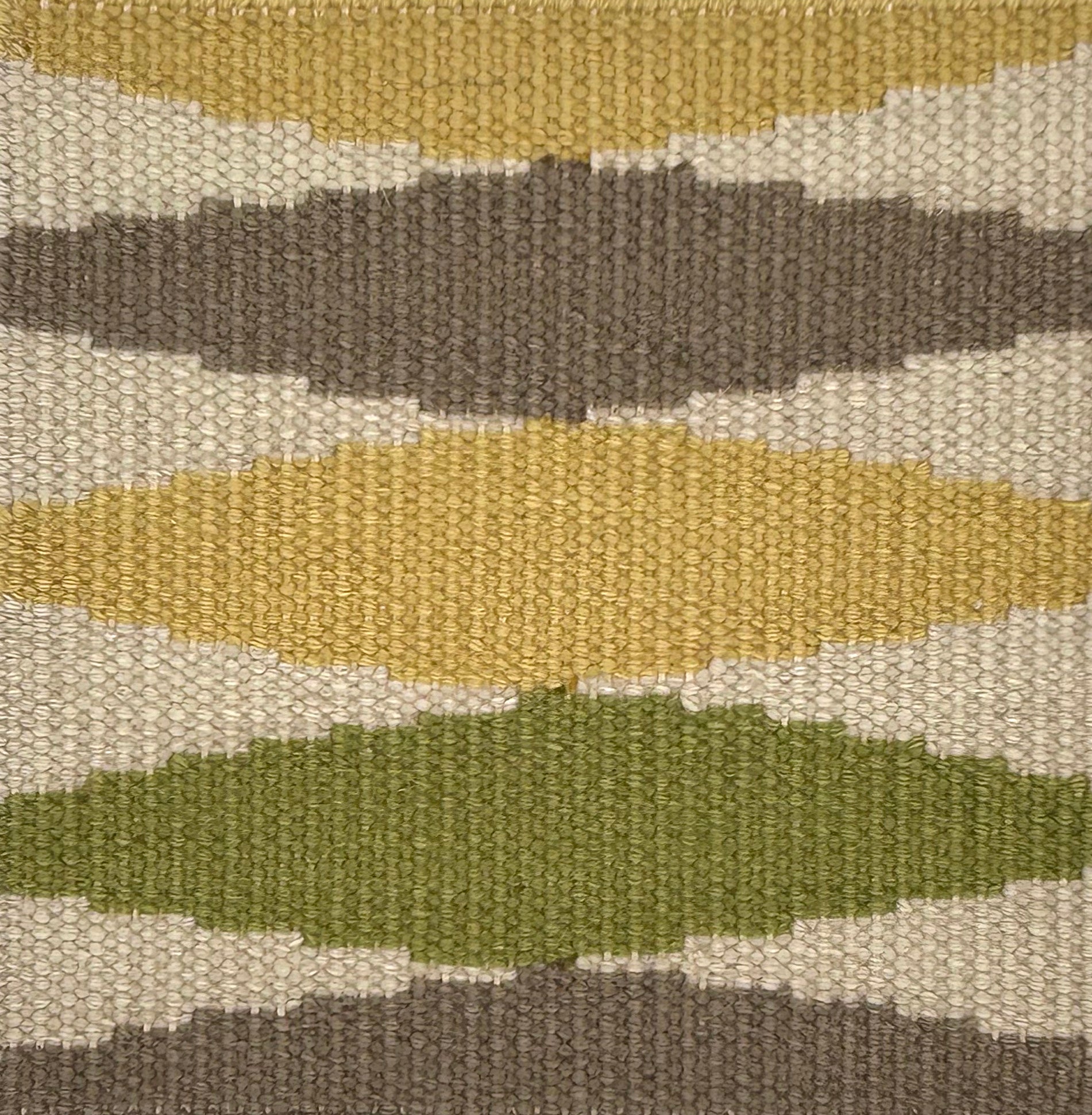 Flatweave carpet with diamonds in yellow. brown, green and cream. 