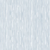 Detail of fabric in a painterly stripe pattern in navy on a white field.