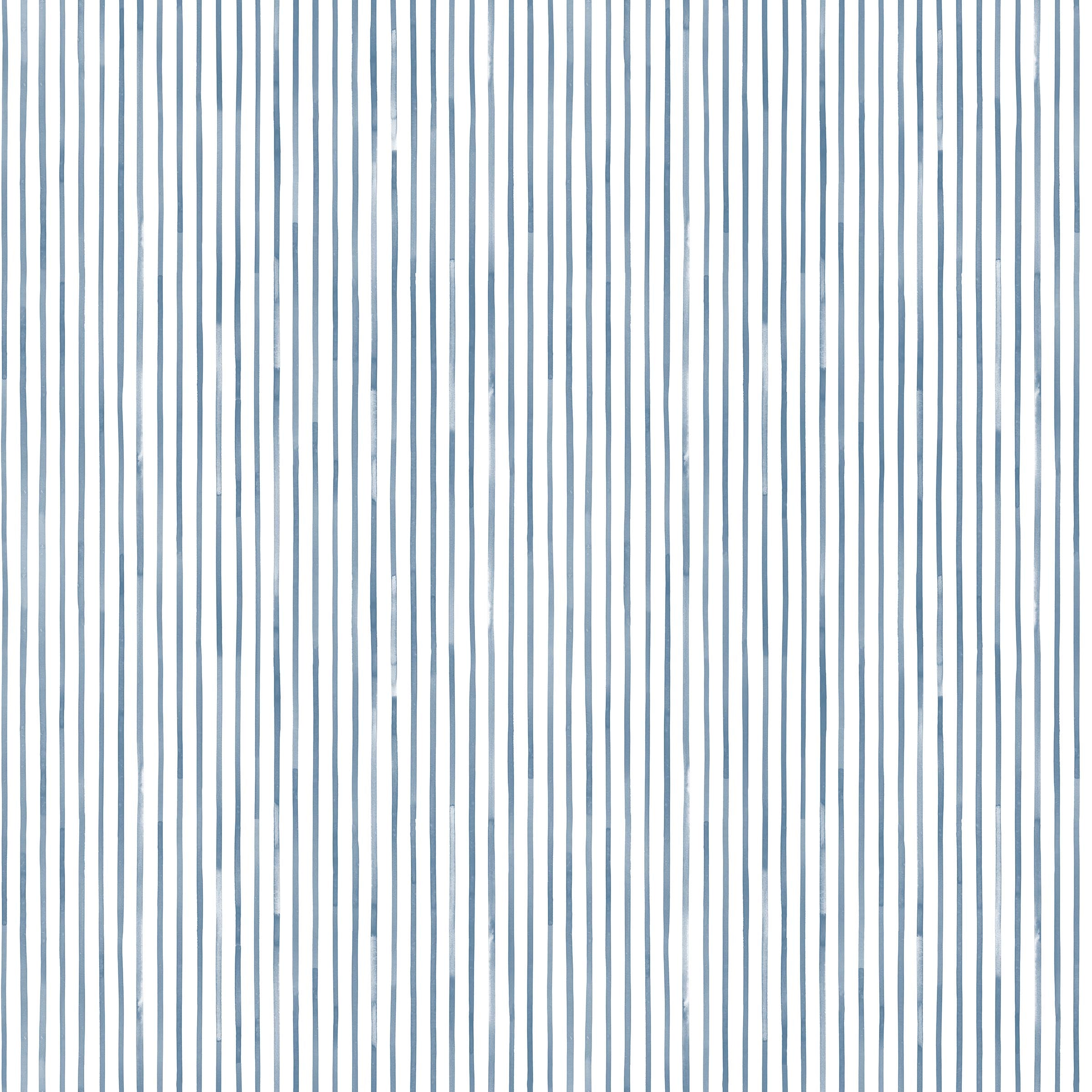 Detail of fabric in a painterly stripe pattern in navy on a white field.