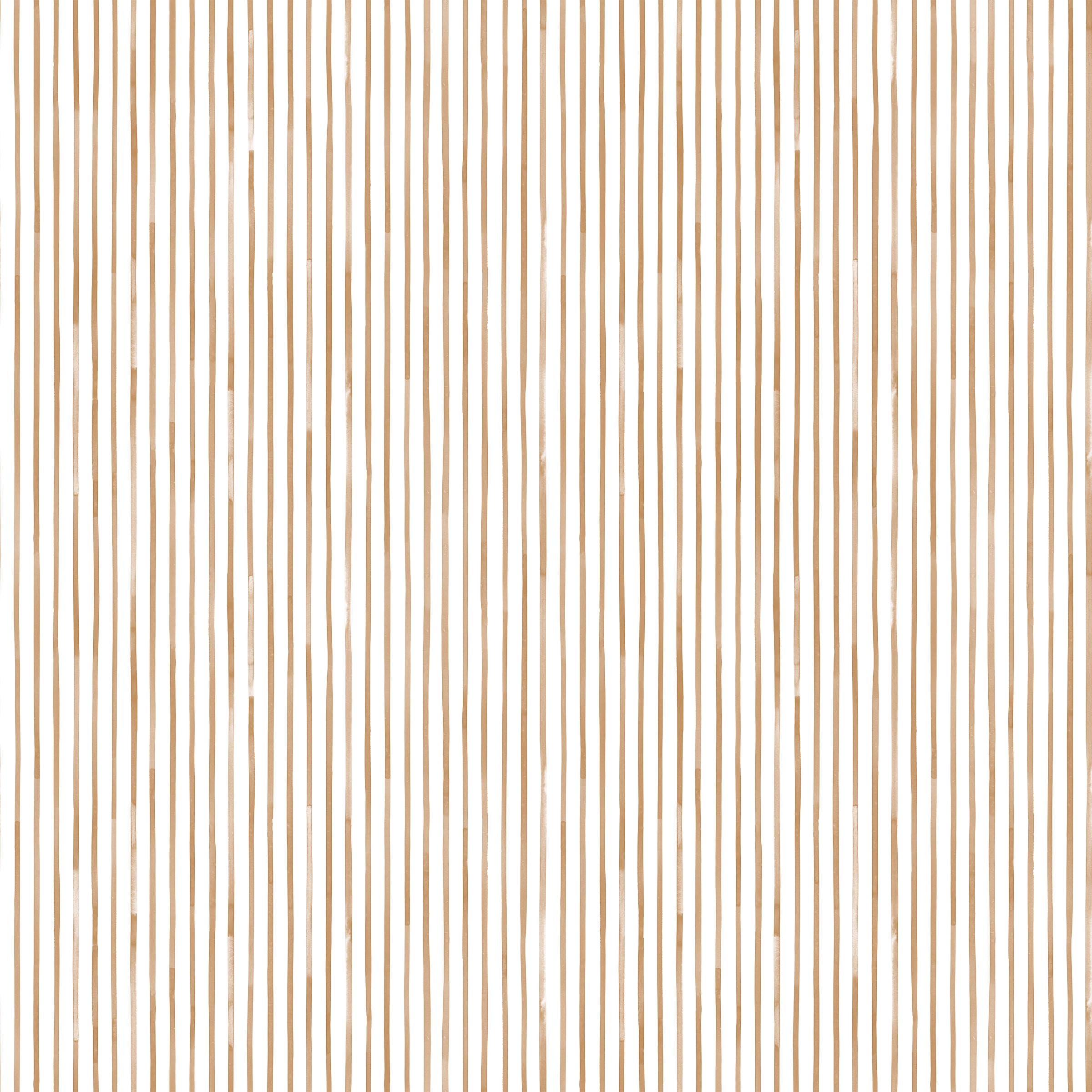 Detail of fabric in a painterly stripe pattern in bronze on a white field.