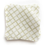 A stack of fabric swatches in a painterly grid pattern in light green on a white field.