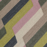 Detail of a handwoven rug with a stacked zig zag stripe in purple, lime green, cream and shades of grey. 