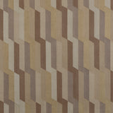 Detail of a handwoven rug with a stacked zig zag stripe in shades of brown, taupe, and tan. 
