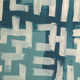 Detail of wallpaper in an abstract paint print in shades of blue, turquoise and cream.