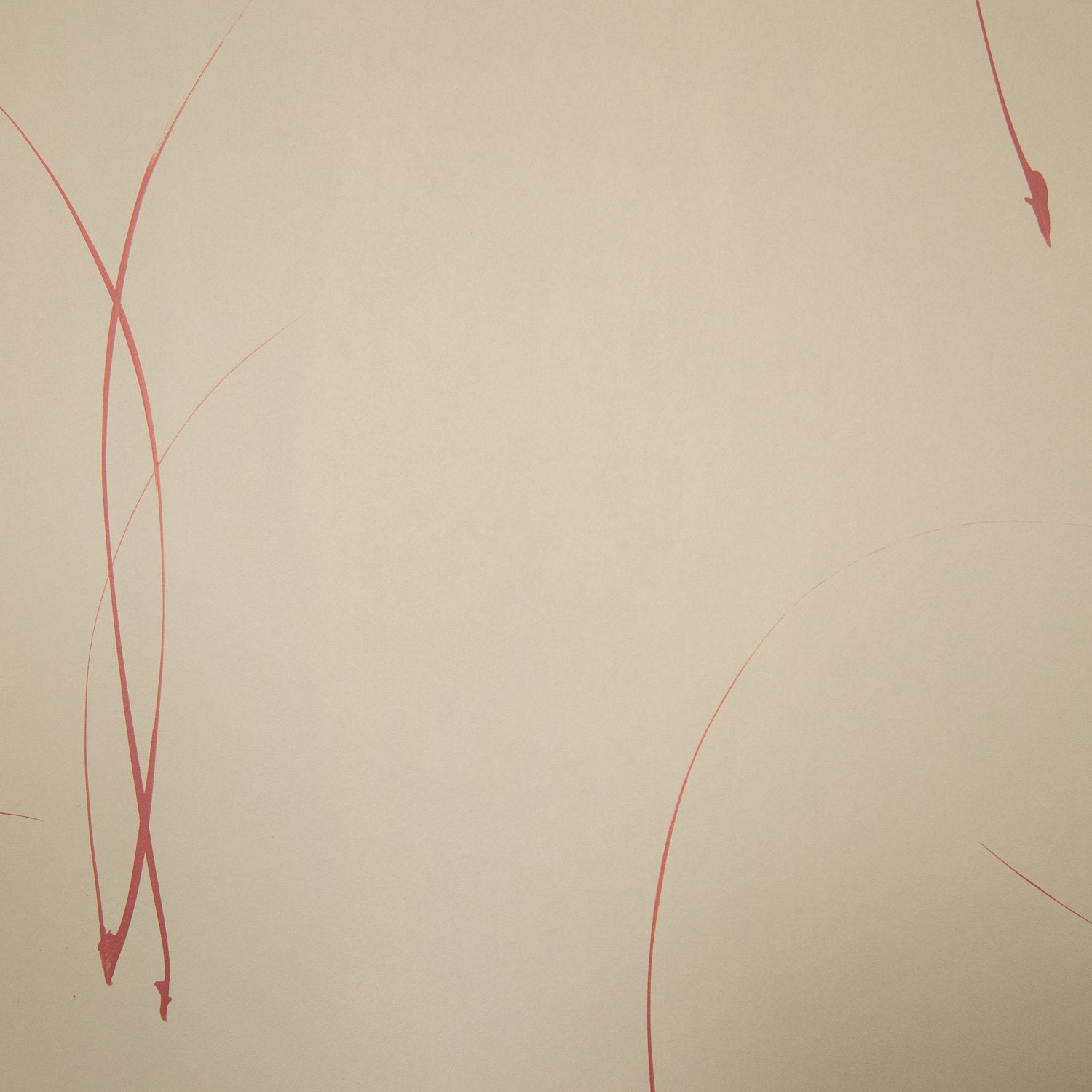 Detail of a wallpaper in an elongated paint splatter pattern in metallic navy on a rust field.