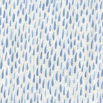 Fabric in a painterly dabbed print in blue on a white field.