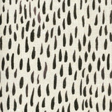 Fabric in a painterly dabbed print in charcoal on a cream field.