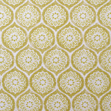 Detail of fabric in a floral lattice print in yellow on a cream field.