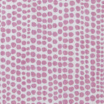 Detail of wallpaper in a painterly dotted print in light purple on a white field.