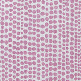 Detail of wallpaper in a painterly dotted print in light purple on a white field.