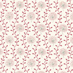 Detail of fabric in a repeating dandelion and leaf print in pink and red on a cream field.