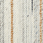 Close-up of a broadloom carpet fabric with stripes in beige, brown, and gray.