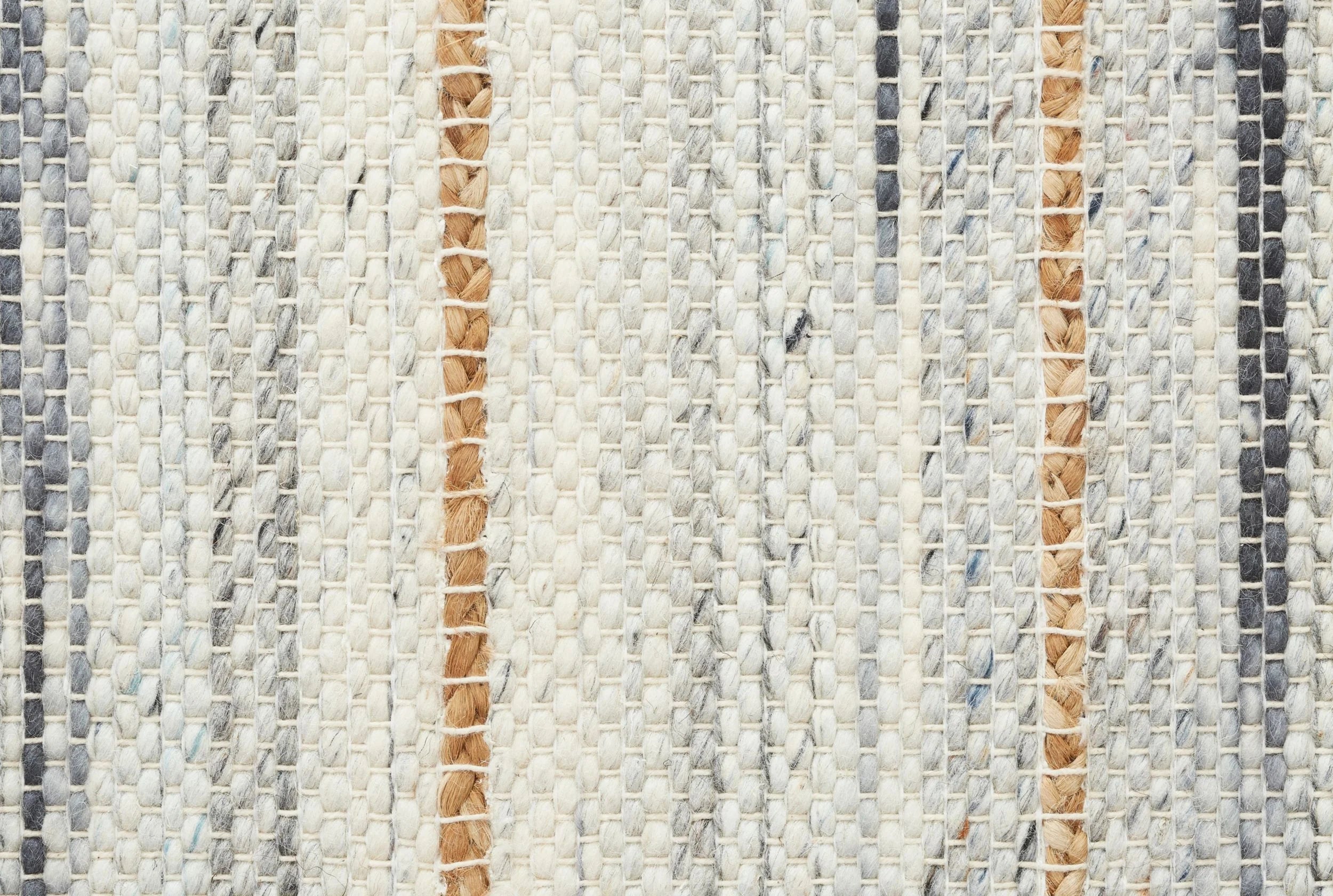 Close-up of a broadloom carpet fabric with stripes in beige, brown, and gray.