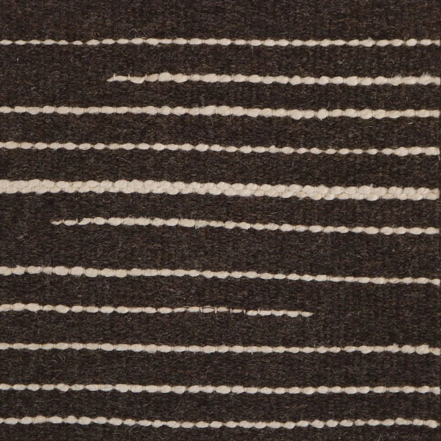 Broadloom carpet swatch in striped pattern brown color