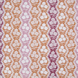 Fabric in a detailed botanical stripe print in shades of pink, purple and orange on a white field.
